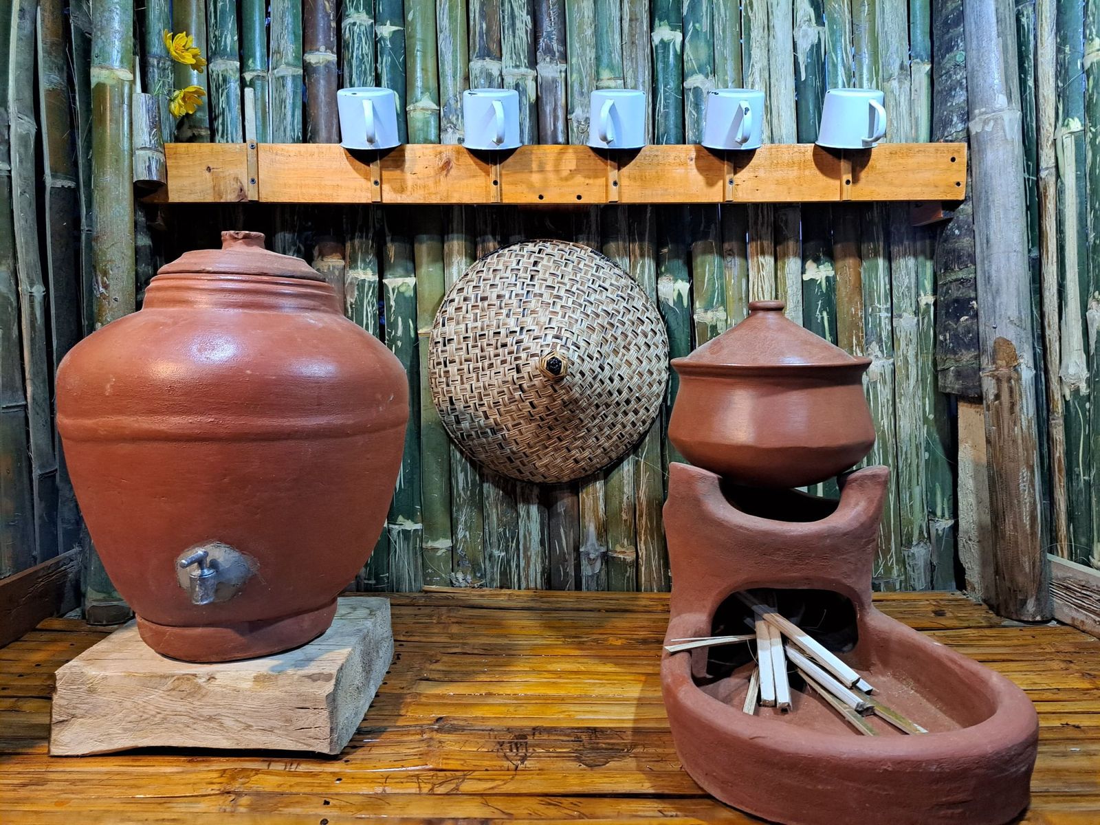 Clay water jug and stove corner